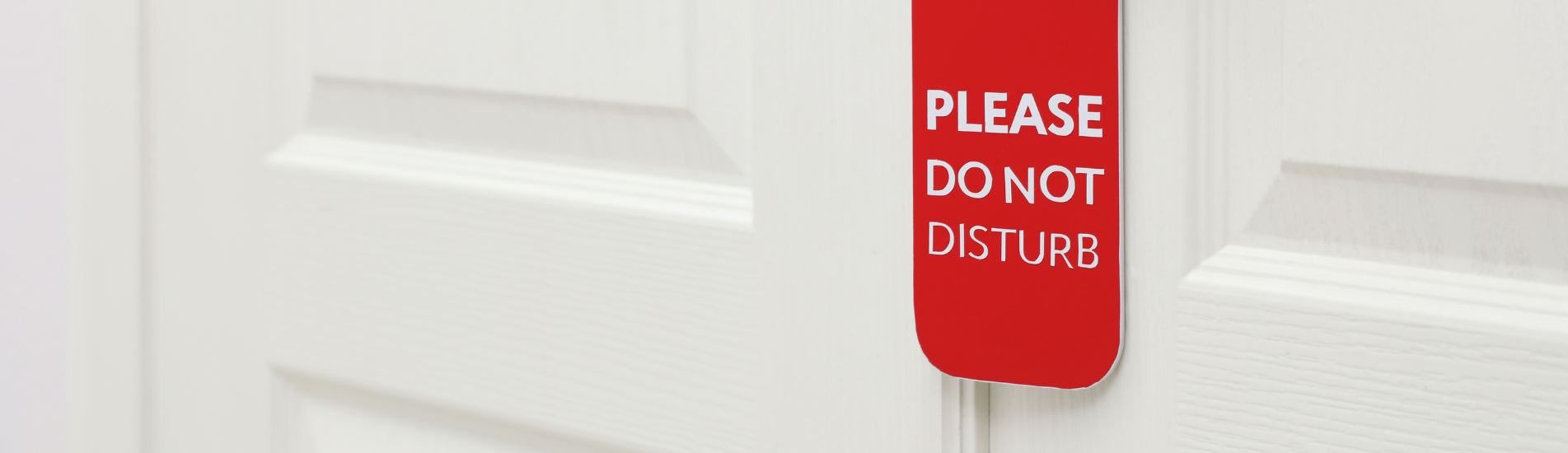 seal-a-door-acoustically-hero please do not disturb sign on door