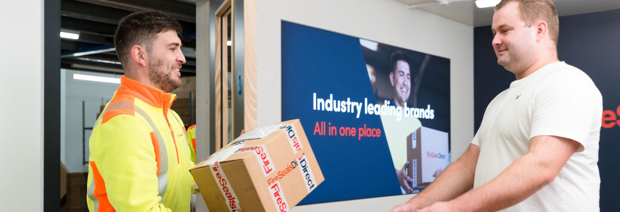 Man handing a parcel to customer