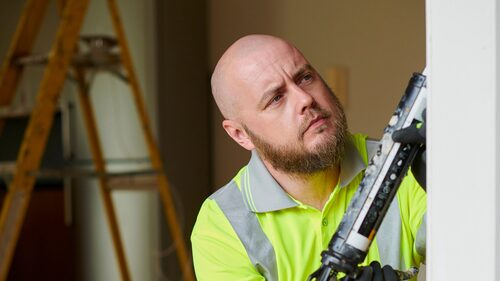 Tradesman applying sealant